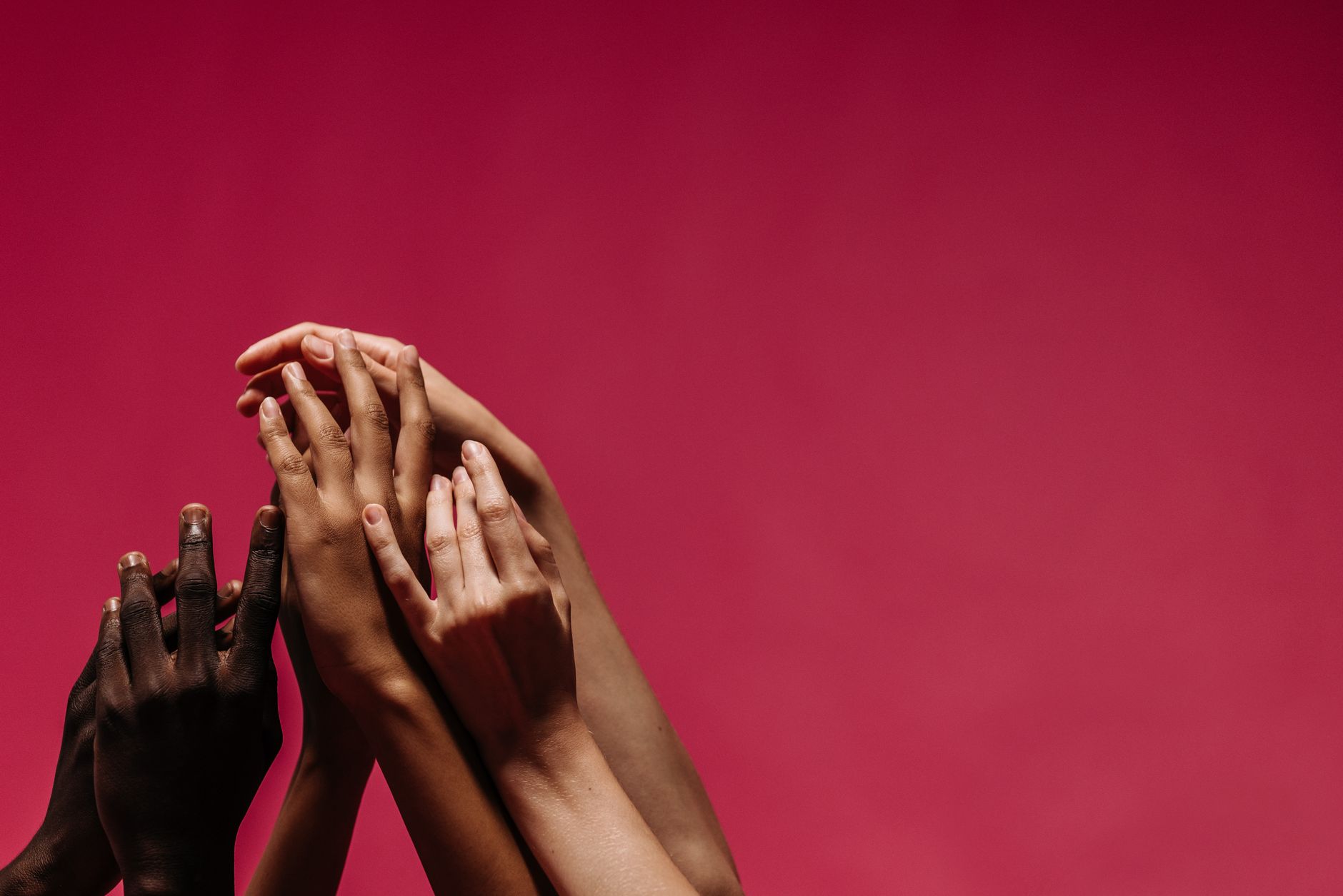 diverse hands holding, supporting