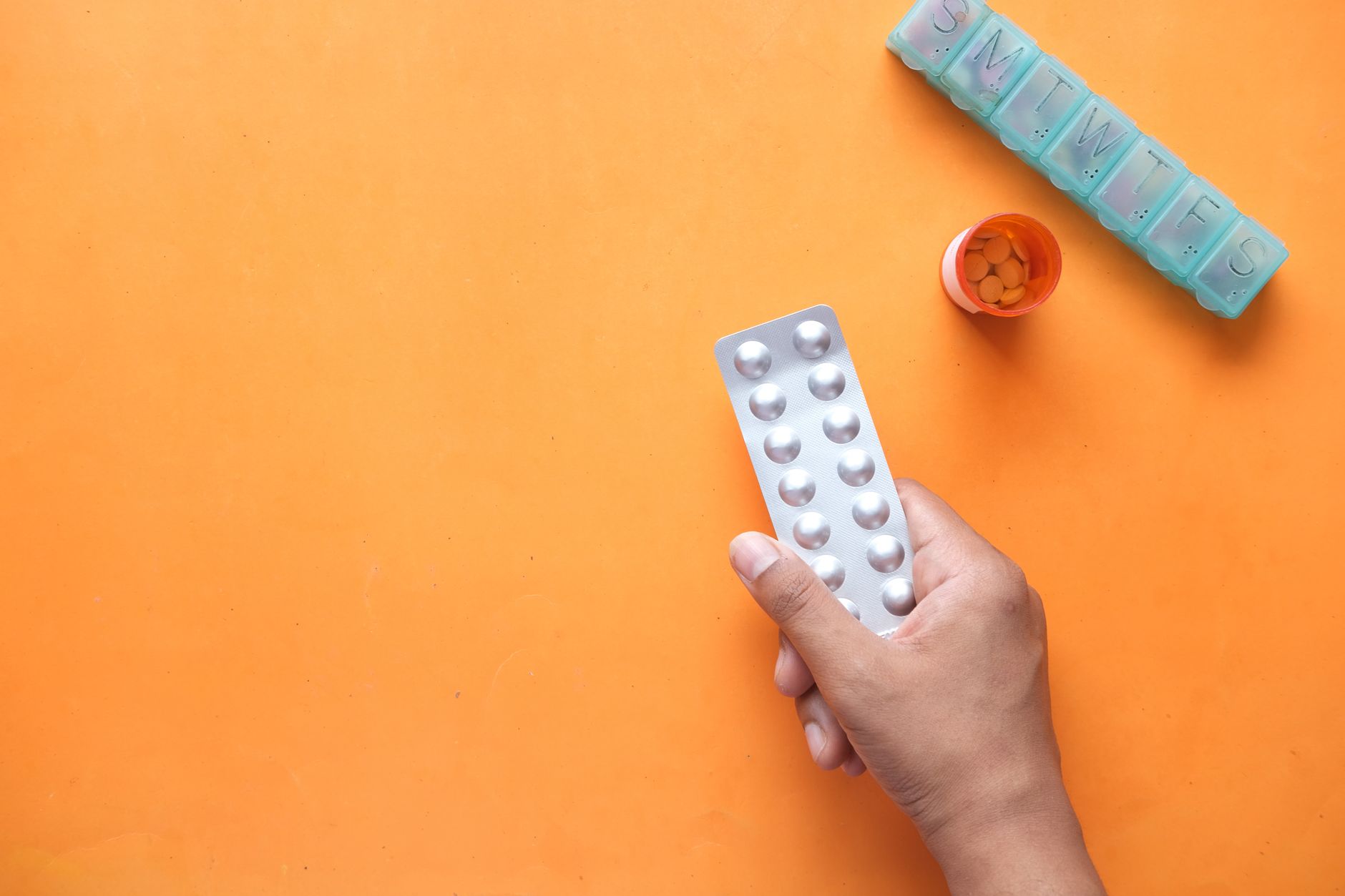 person taking food supplements