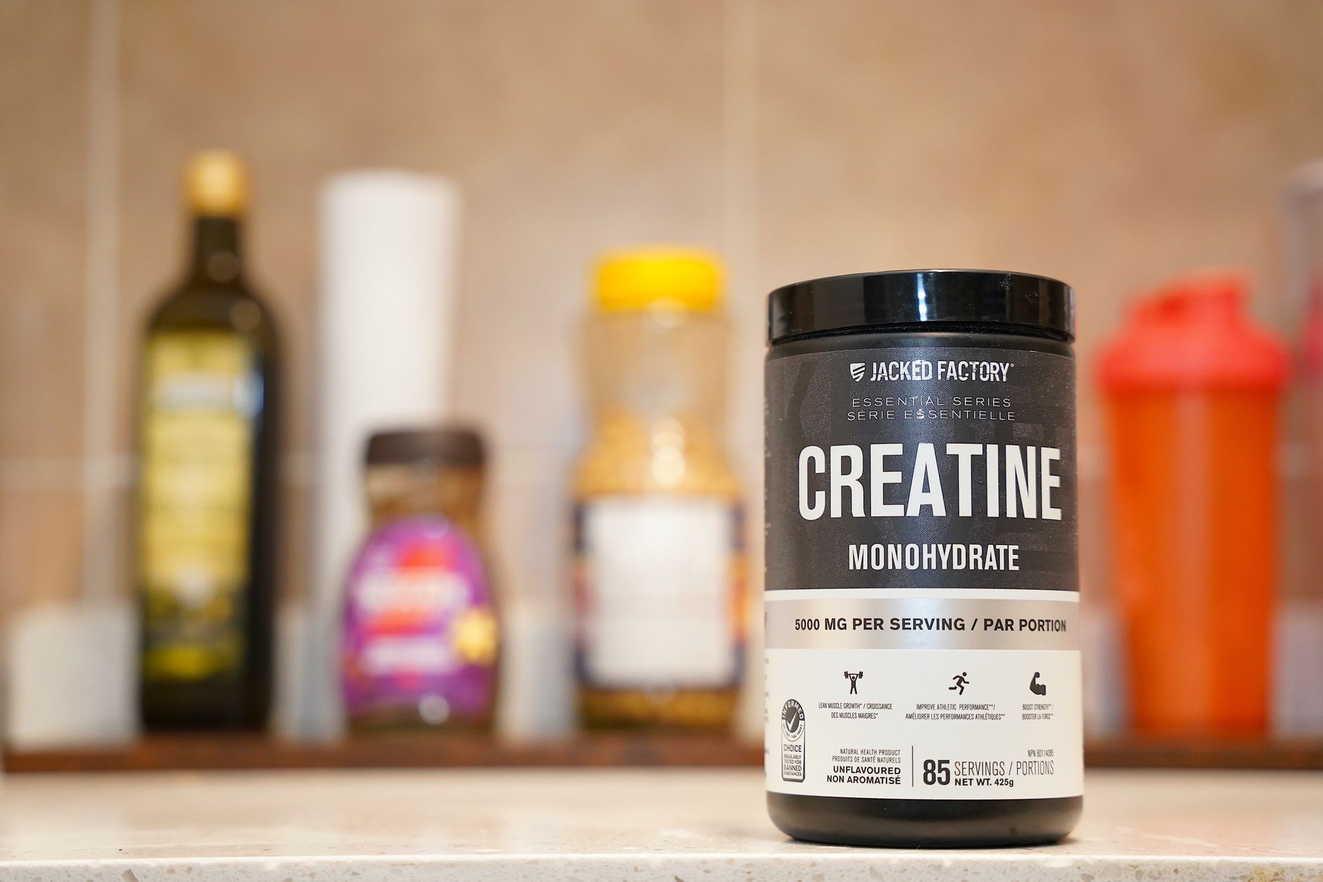 various sports supplements, protein powder, magnesium bottle