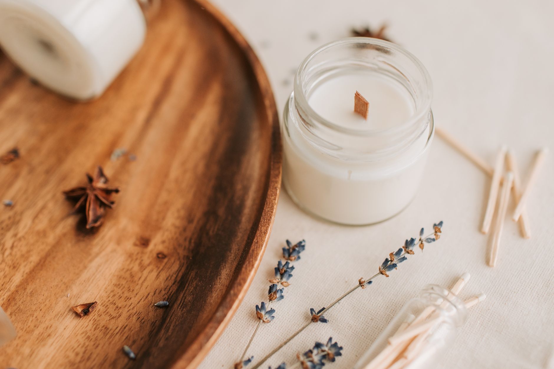 natural soy candles in glass jars with plants