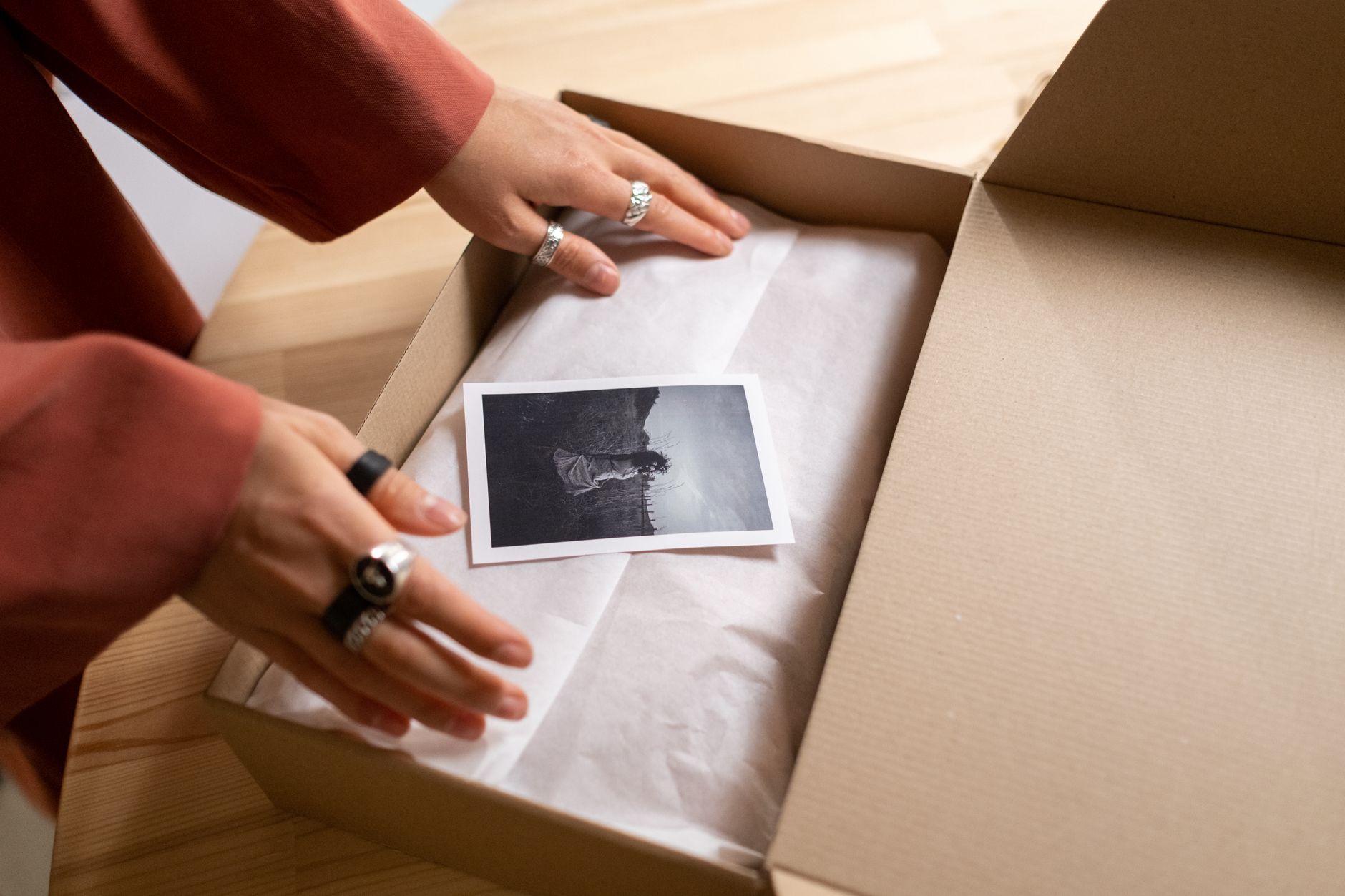 person unboxing a package of supplements and sportswear