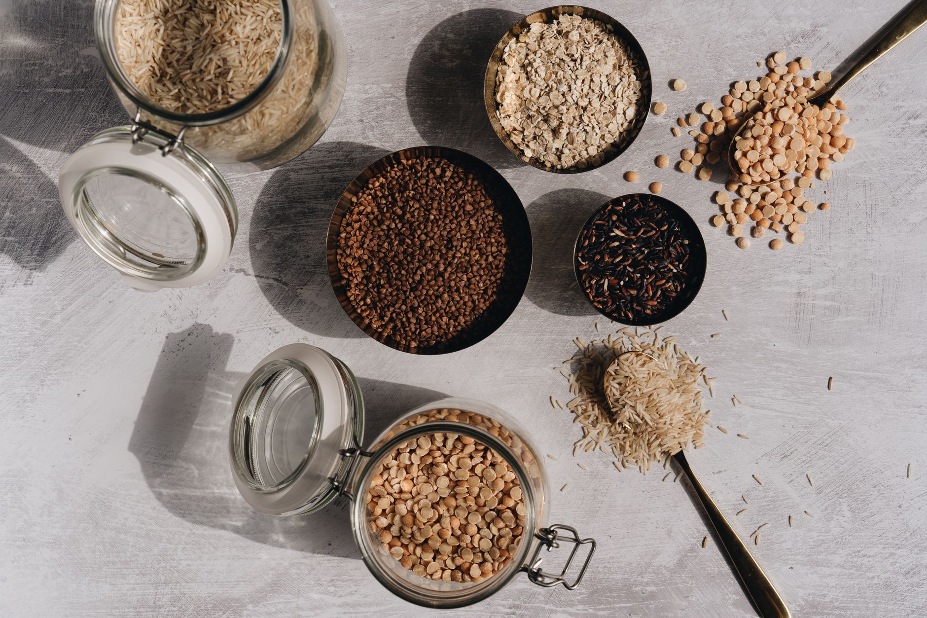 various dried legumes and grains in bowls